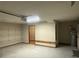 Spacious garage with storage shelves and door to an interior storage area at 11248 Sw 76Th Ter, Ocala, FL 34476
