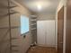 Laundry room with ample shelving and storage space; a window for natural light at 11248 Sw 76Th Ter, Ocala, FL 34476