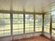 Enclosed patio with screens and a view of the backyard at 11248 Sw 76Th Ter, Ocala, FL 34476