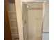 Shower with glass doors and tiled walls at 11248 Sw 76Th Ter, Ocala, FL 34476