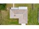 Overhead drone view of the house showing the roof, yard, and nearby neighborhood at 12 Hemlock Radial Pass, Ocala, FL 34472