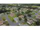 A beautiful aerial view showcases this home's location in a serene, tree-lined neighborhood at 13715 Se 88Th Ct, Summerfield, FL 34491