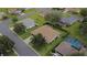 Aerial view highlights the home's location on a well-manicured street with mature trees at 13715 Se 88Th Ct, Summerfield, FL 34491