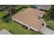Aerial view featuring a new roof, well-maintained yard, and tidy landscaping at 13715 Se 88Th Ct, Summerfield, FL 34491