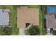 Bird's eye view of home with manicured landscaping and nearby screened-in pool at 13715 Se 88Th Ct, Summerfield, FL 34491