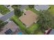Aerial view of a single Gathering home featuring a well-maintained lawn and mature landscaping at 13715 Se 88Th Ct, Summerfield, FL 34491