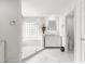 Bathroom featuring a glass shower, marble floors, and vanity at 13715 Se 88Th Ct, Summerfield, FL 34491