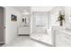 Bathroom featuring marble floors, glass shower, and vanity at 13715 Se 88Th Ct, Summerfield, FL 34491