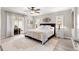 Bedroom with ceiling fan, slider to patio, and rug at 13715 Se 88Th Ct, Summerfield, FL 34491