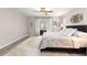 Bedroom with ceiling fan, slider to patio, and floral pattern bedding at 13715 Se 88Th Ct, Summerfield, FL 34491