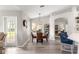 Cozy dining area with modern lighting adjacent to the well-appointed kitchen at 13715 Se 88Th Ct, Summerfield, FL 34491