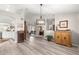 Open-concept living area showcasing stylish furniture, light-filled rooms, and luxury flooring at 13715 Se 88Th Ct, Summerfield, FL 34491