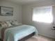 Comfortable bedroom featuring a nautical-themed decor and natural light from the window at 14192 Sw 112Th Cir, Dunnellon, FL 34432