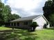 Exterior of home showcasing the screened-in porch and vinyl siding at 14192 Sw 112Th Cir, Dunnellon, FL 34432