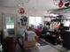 Spacious garage featuring a golf cart, storage shelving and side entry door at 14192 Sw 112Th Cir, Dunnellon, FL 34432