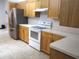 Clean kitchen featuring modern appliances, light wooden cabinets, and tile floors at 14192 Sw 112Th Cir, Dunnellon, FL 34432