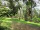 Lush landscape with tree lined path, great for afternoon walks and relaxation at 14192 Sw 112Th Cir, Dunnellon, FL 34432
