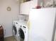 Functional laundry room with cabinets and appliances at 14192 Sw 112Th Cir, Dunnellon, FL 34432