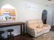 Inviting living room with recliner seating and a bar pass-through to kitchen at 14192 Sw 112Th Cir, Dunnellon, FL 34432