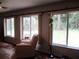 Bright living room with recliner seating, natural light and wood-look floors at 14192 Sw 112Th Cir, Dunnellon, FL 34432