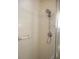 Shower showcasing tiled walls, a grab bar, and a modern showerhead fixture at 14192 Sw 112Th Cir, Dunnellon, FL 34432