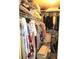 Spacious walk-in closet with organized shelving and hanging racks, maximizing storage capacity at 14192 Sw 112Th Cir, Dunnellon, FL 34432