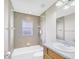 Full bathroom with a combined shower and tub, tiled walls, and updated fixtures at 145 Harbor Way, Auburndale, FL 33823