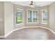 Sun-filled dining area boasting three large windows and neutral tile flooring at 145 Harbor Way, Auburndale, FL 33823