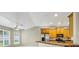 Bright eat-in kitchen features stainless appliances, wood cabinetry, and ample natural light from the large windows at 145 Harbor Way, Auburndale, FL 33823