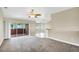 Bright living room with access to a screened patio and views into other living spaces at 145 Harbor Way, Auburndale, FL 33823