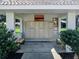 Community mailboxes under a sheltered area with benches and lush landscaping at 145 Harbor Way, Auburndale, FL 33823