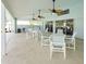 Covered patio area with tables and chairs, perfect for gatherings at 145 Harbor Way, Auburndale, FL 33823