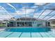Gorgeous community pool with tables and fans for shade at 145 Harbor Way, Auburndale, FL 33823