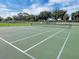 Clean community tennis court perfect for a match with friends at 145 Harbor Way, Auburndale, FL 33823