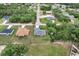 The home's aerial view shows it nestled amongst other single Gathering homes with plenty of mature trees at 17277 Sw 44Th Cir, Ocala, FL 34473