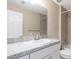Bathroom featuring spacious vanity and tiled shower at 17277 Sw 44Th Cir, Ocala, FL 34473