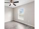 Bedroom features neutral walls, window, and sleek flooring at 17277 Sw 44Th Cir, Ocala, FL 34473