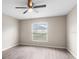 Bedroom showcasing modern flooring, window views, and neutral walls at 17277 Sw 44Th Cir, Ocala, FL 34473
