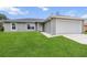 Charming single-story home featuring a well-manicured lawn and an attached one-car garage at 17277 Sw 44Th Cir, Ocala, FL 34473
