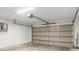 Spacious two car garage features an automatic door, side electrical panel, and ample space for storage at 17277 Sw 44Th Cir, Ocala, FL 34473