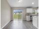 Kitchen area featuring stainless steel appliances, white cabinets, and modern backsplash at 17277 Sw 44Th Cir, Ocala, FL 34473
