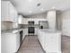 Spacious kitchen featuring modern appliances, white cabinetry, and granite countertops at 17277 Sw 44Th Cir, Ocala, FL 34473