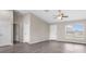 Bright and open living room area showcasing multiple doorways, windows, and luxury vinyl flooring at 17277 Sw 44Th Cir, Ocala, FL 34473