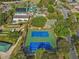 Aerial view of community amenities including tennis courts, pools, and green spaces at 17720 Se 115Th Ct, Summerfield, FL 34491