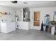 Functional garage space with laundry facilities and ample storage area at 17720 Se 115Th Ct, Summerfield, FL 34491