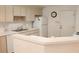 Well-lit kitchen featuring ample cabinetry and counter space for cooking and storage at 17720 Se 115Th Ct, Summerfield, FL 34491