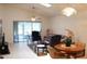 Spacious living room with lots of natural light and comfortable furniture at 17720 Se 115Th Ct, Summerfield, FL 34491