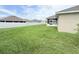 Large backyard with a shed, a patio, lawn and a white fence for privacy and security at 186 Nw 44Th St, Ocala, FL 34475