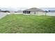 The back of the home featuring the lawn, patio, a storage shed and a fence, perfect for outdoor enjoyment at 186 Nw 44Th St, Ocala, FL 34475