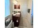 Bathroom with a vanity, sink, towel rack, and natural light from a nearby window at 186 Nw 44Th St, Ocala, FL 34475